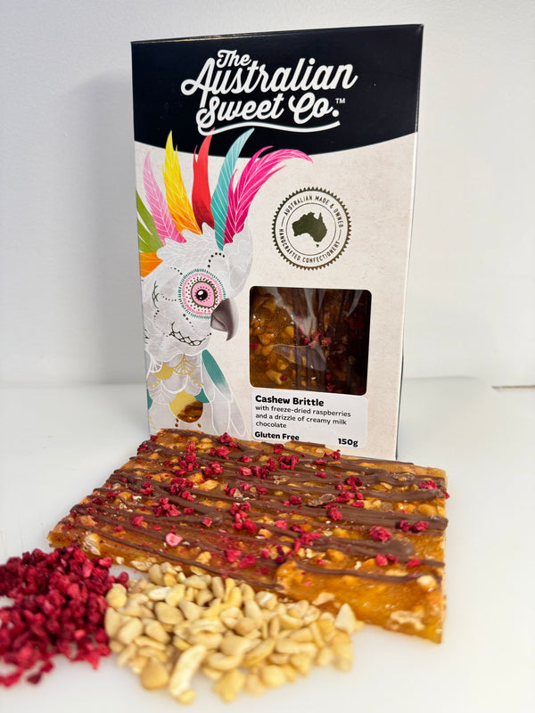 Cashew Brittle with freeze-dried raspberries and a drizzle of creamy milk chocolate